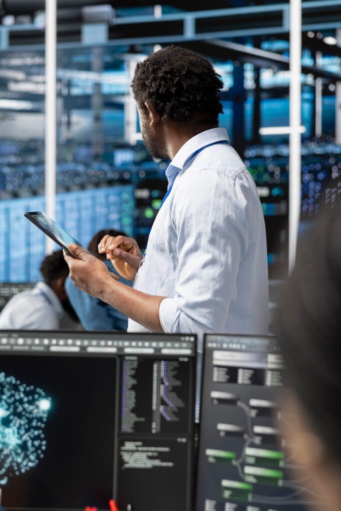 data-center-admin-uses-ai-visualization-technology-tablet-oversee-tasks (1)